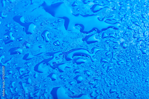 water drop on surface of fresh blue background