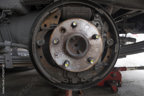 Close up of old hub wheel car. Rust on hub wheel. Rear wheel.