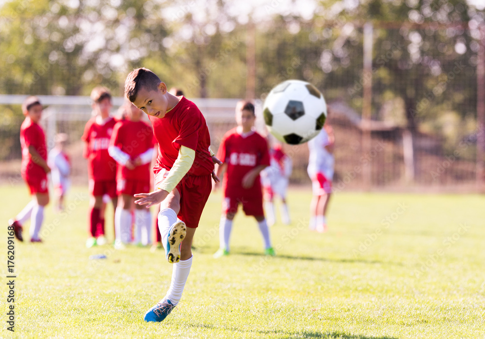 Kids soccer football - young children players match on soccer field Kids soccer football - young children players match on soccer field