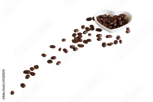 coffee beans in saucer on white background