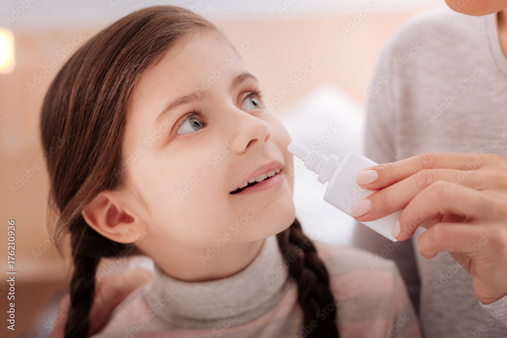 Curious recovering child with nasal drops Curious recovering child with nasal drops