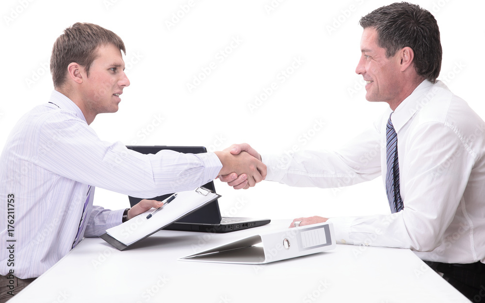 Two handsome men shaking hands with smile while sitting Two handsome men shaking hands with smile while sitting