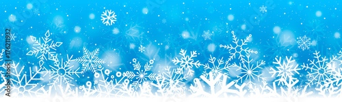 Christmas banner with snowflakes on blue background