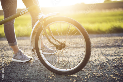 Close-up of bicycle wheel in sunlight