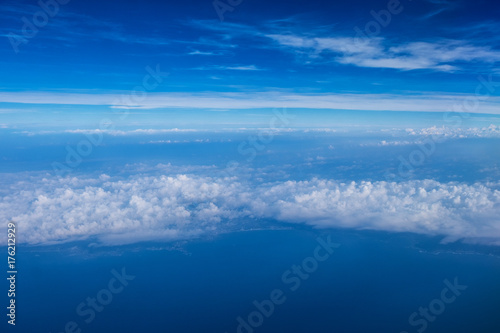 Cloud texture and blue sky view from airplane.