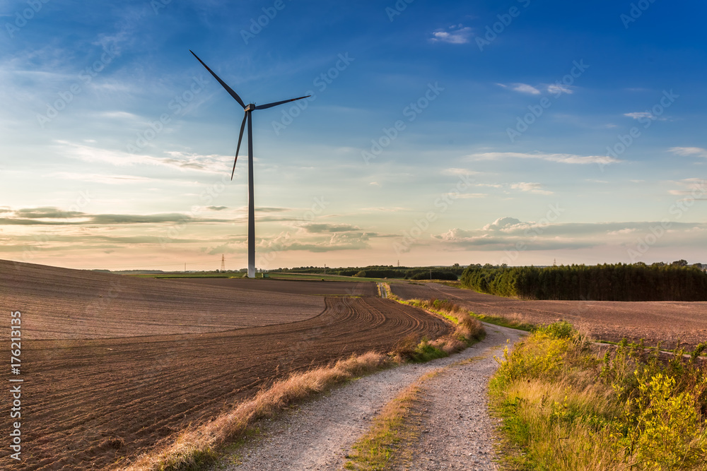 Amazing sunset at countryside with wind turbine in autumn Amazing sunset at countryside with wind turbine in autumn
