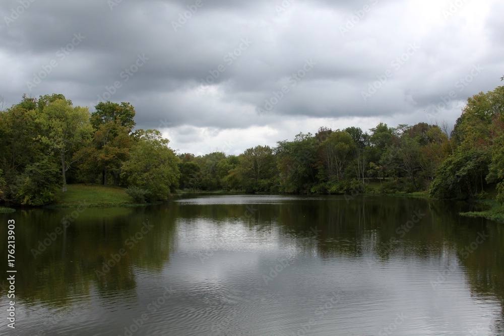 A cloudy day at the lake in the park. A cloudy day at the lake in the park.