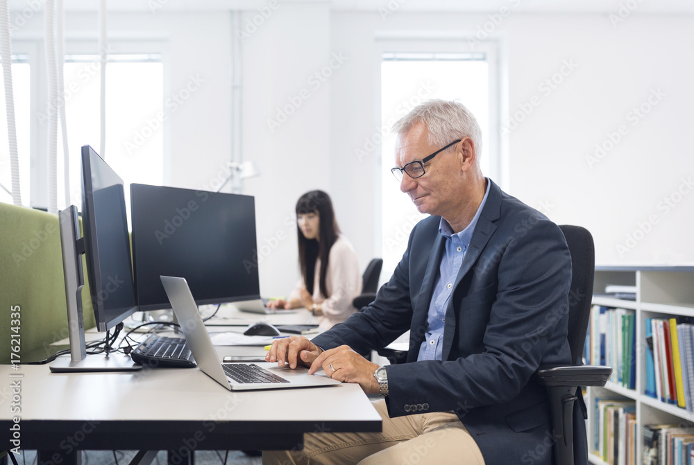 Architects and project managers working in office Architects and project managers working in office