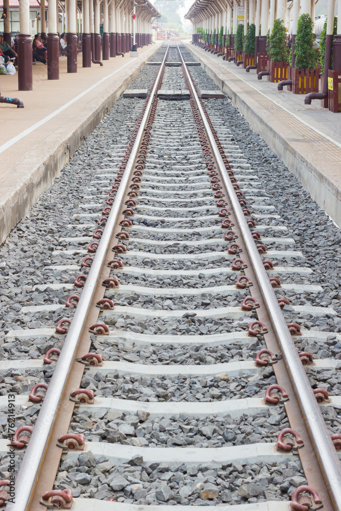 perspective train tracks at the railway station perspective train tracks at the railway station