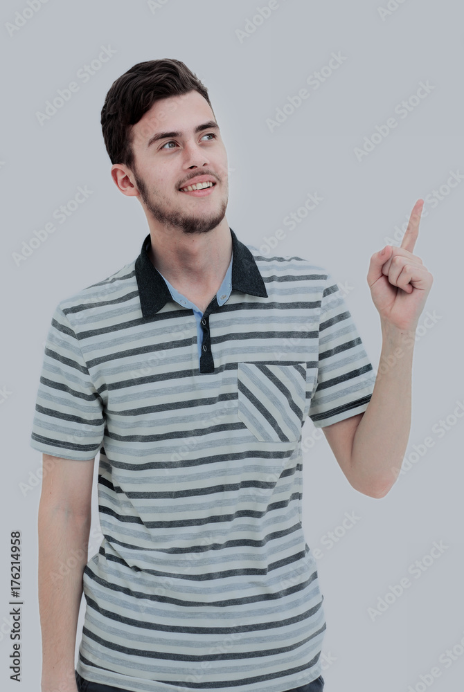 Young man pointing at something with his finger