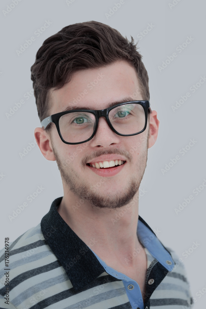 Close-up portrait of attractive young man on white background