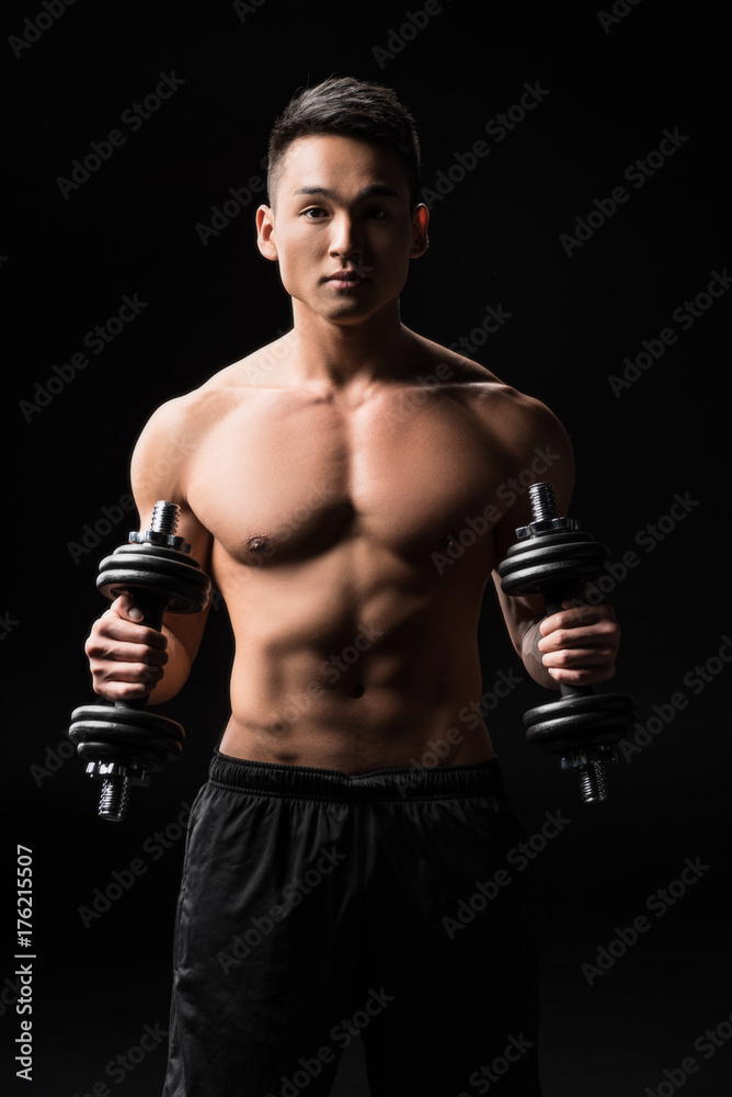 muscular man with dumbbells
