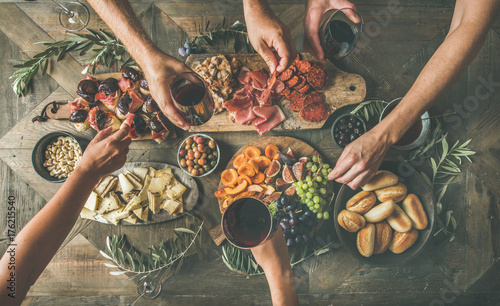 Stampa su Tela Flat-lay of friends eating and drinking together