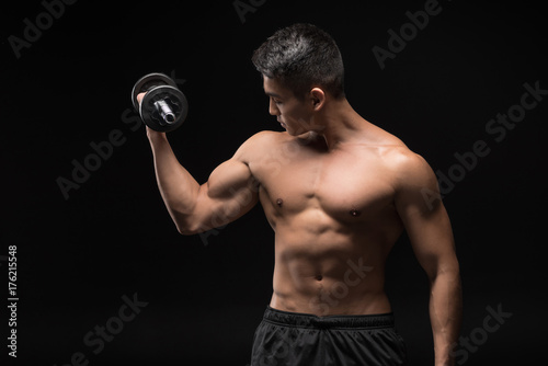 muscular man with dumbbell