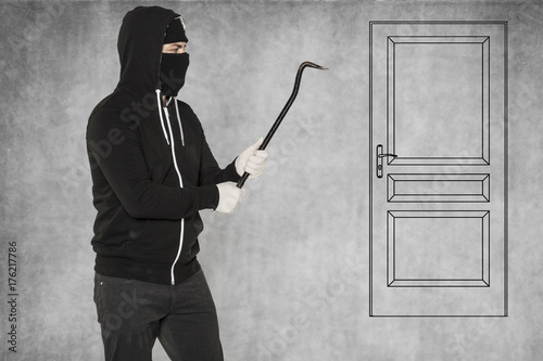 Such a door is easy for a thief, crowbar in hands photo