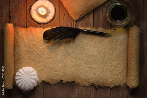 Burning candle and a quill ...