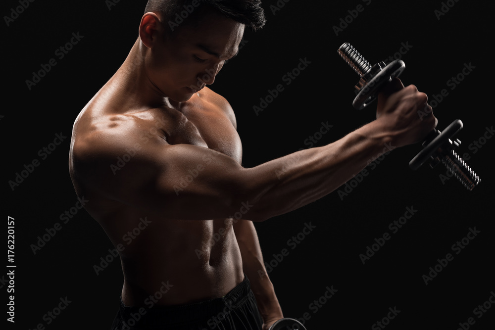 muscular man with dumbbell