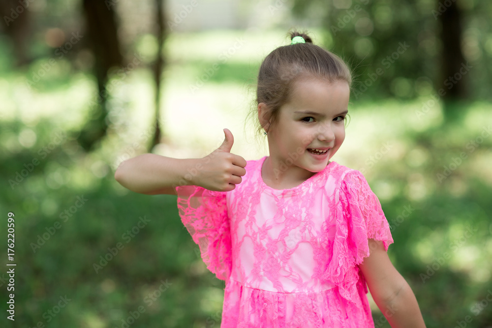 Caucasian girl posing on camera showing approving sign with hands Caucasian girl posing on camera showing approving sign with hands