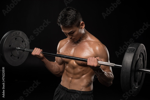 muscular asian man with barbell