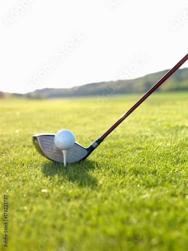 Driver and goof ball on tee