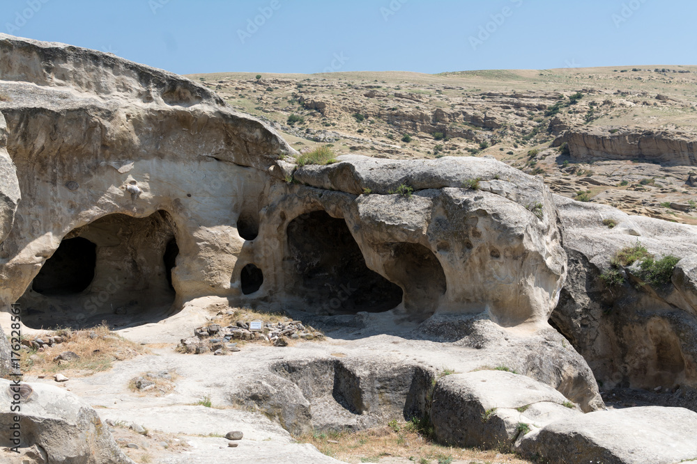 Ruins of ancient houses, hewn in solid rocks in underground Georgian town Uplistsikhe