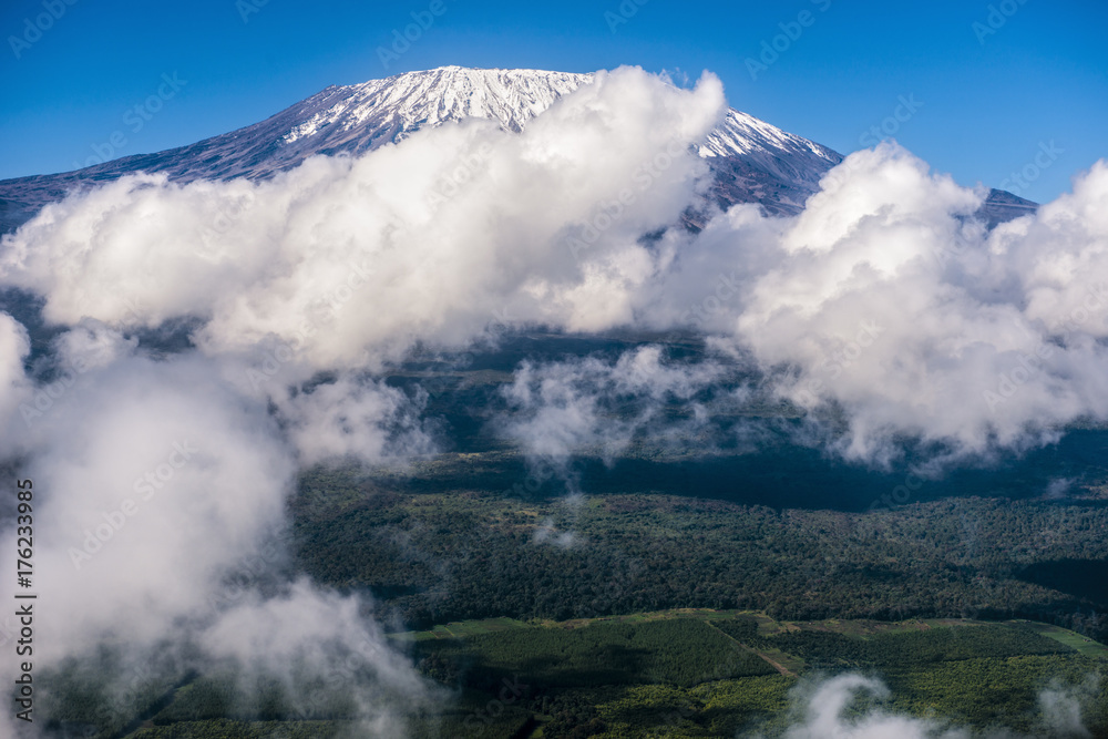 beautiful landscape with kilimanjaro mountain surrounded by clouds