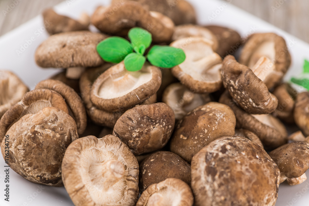 Portion of Raw Shiitake mushrooms, selective focus Portion of Raw Shiitake mushrooms, selective focus