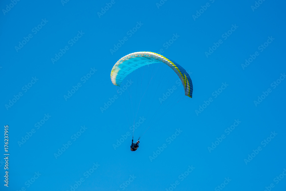 Yellow Paraglider over the Europe Alps mountains Yellow Paraglider over the Europe Alps mountains