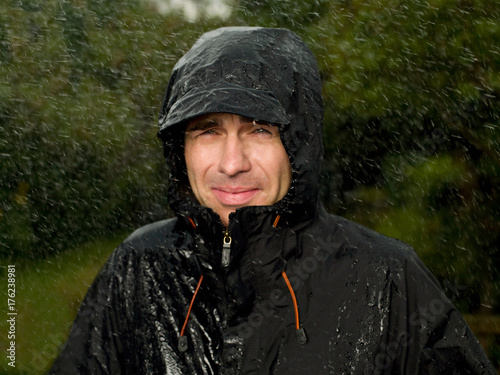 A man getting soaked in the rain