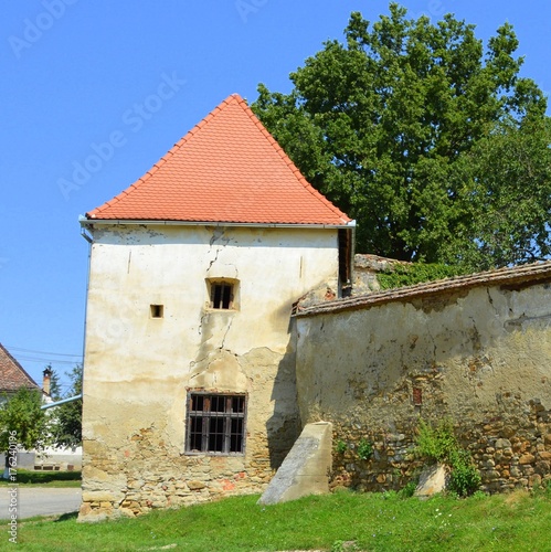 Fortified medieval saxon church in Bruiu - Braller, a commune in Sibiu County, Transylvania, Romania. The settlement was founded by the Saxon colonists in the middle of the 12th century photo