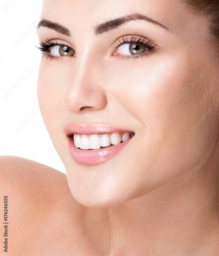 Beautiful face of young adult woman with clean fresh skin. Amazing smile, perfect teeth. Beautiful face of young adult woman with clean fresh skin. Amazing smile, perfect teeth.