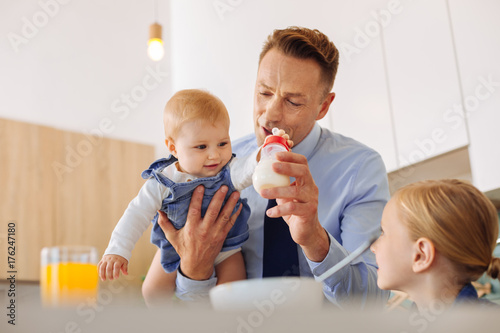 Happy small baby taking a bottle