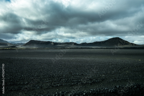 Lunar landscape of Iceland  endless volcanic areas and mountains in the background.