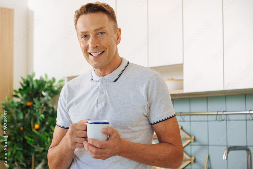 Happy delighted man resting at home Happy delighted man resting at home