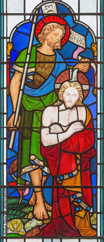 LONDON, GREAT BRITAIN - SEPTEMBER 14, 2017: The Baptism of Christ on stained glass in church St. Michael Cornhill by Clayton and Bell from 19. cent.