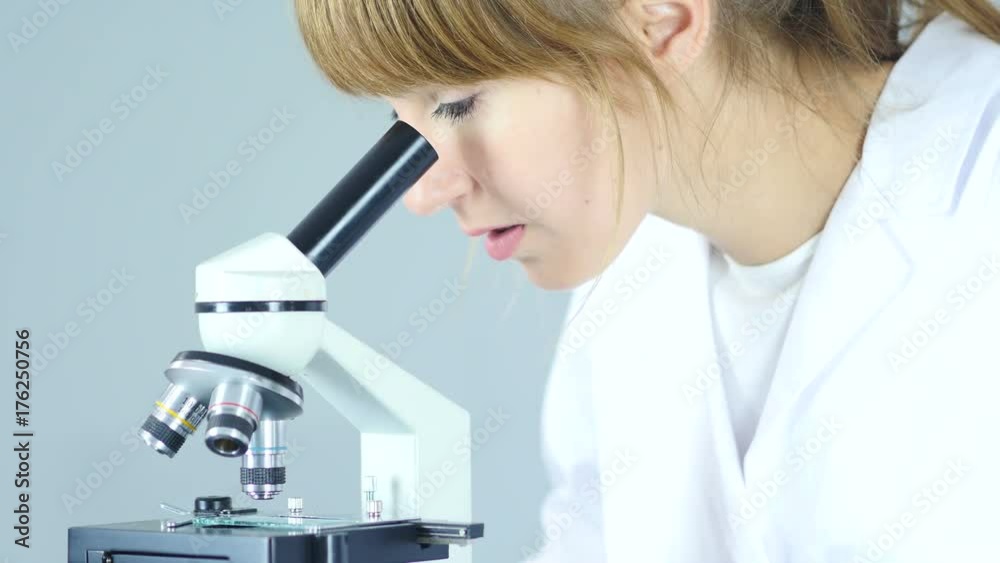 Female Chemist, Scientific Reseacher using Microscope in Laboratory Female Chemist, Scientific Reseacher using Microscope in Laboratory