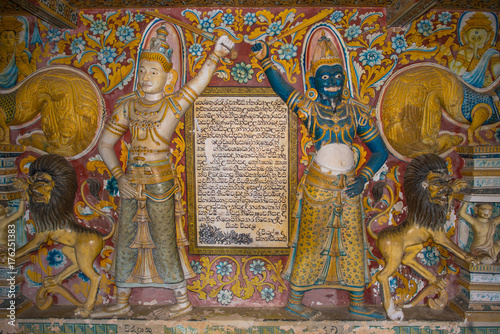 Old murals inside the caves of the Buddhist temple and monastery Mulkirigala Raja Maha Vihara. The complex exist since 1500 years and is the most important cultural-historical temples of the region photo