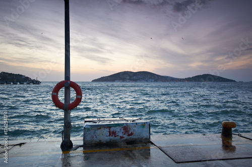 The pictursque pier of Buyukada, Istanbul at sunset photo