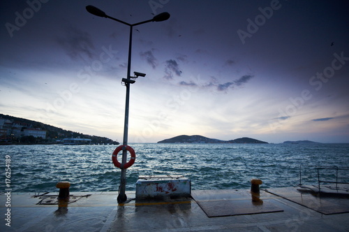 The pictursque pier of Buyukada, Istanbul at sunset photo