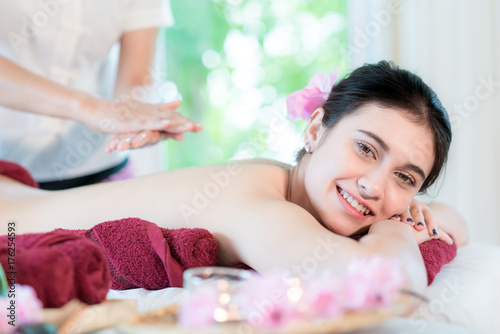Yougn Asian woman relaxing with hand spa massage at beauty spa salon..