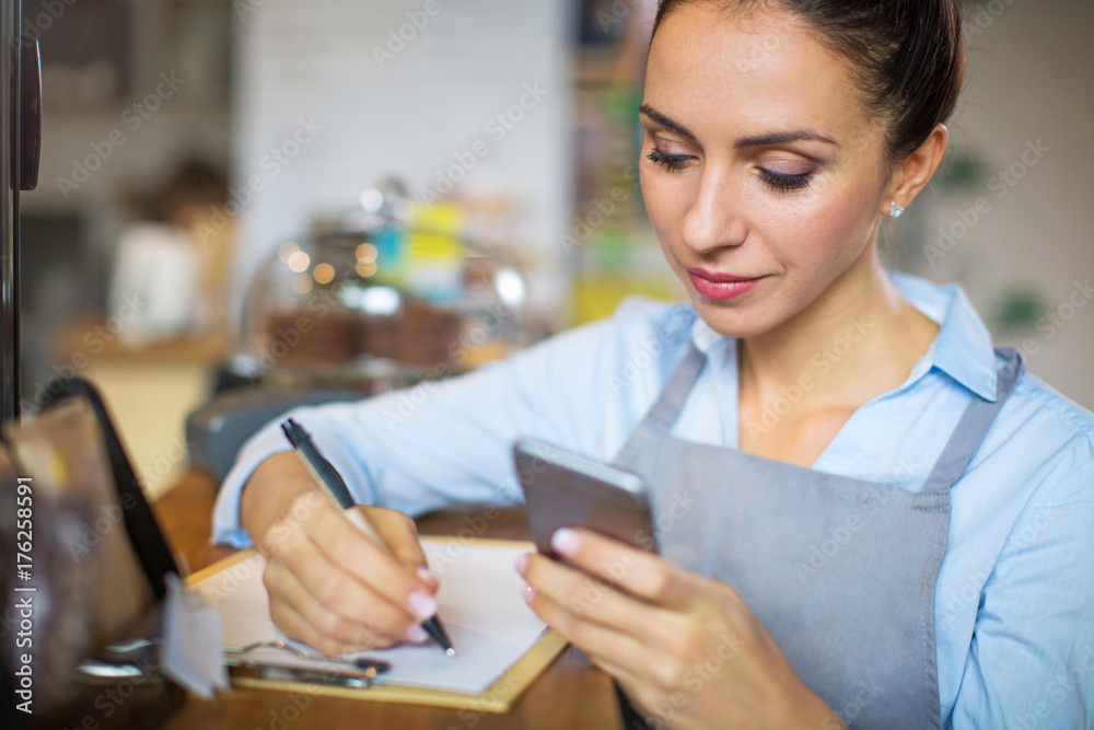 Woman working in coffee shop
