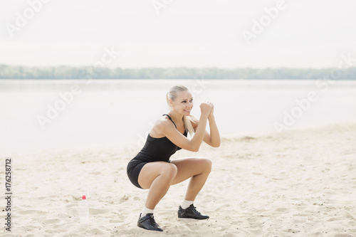  a sporty woman is warming up