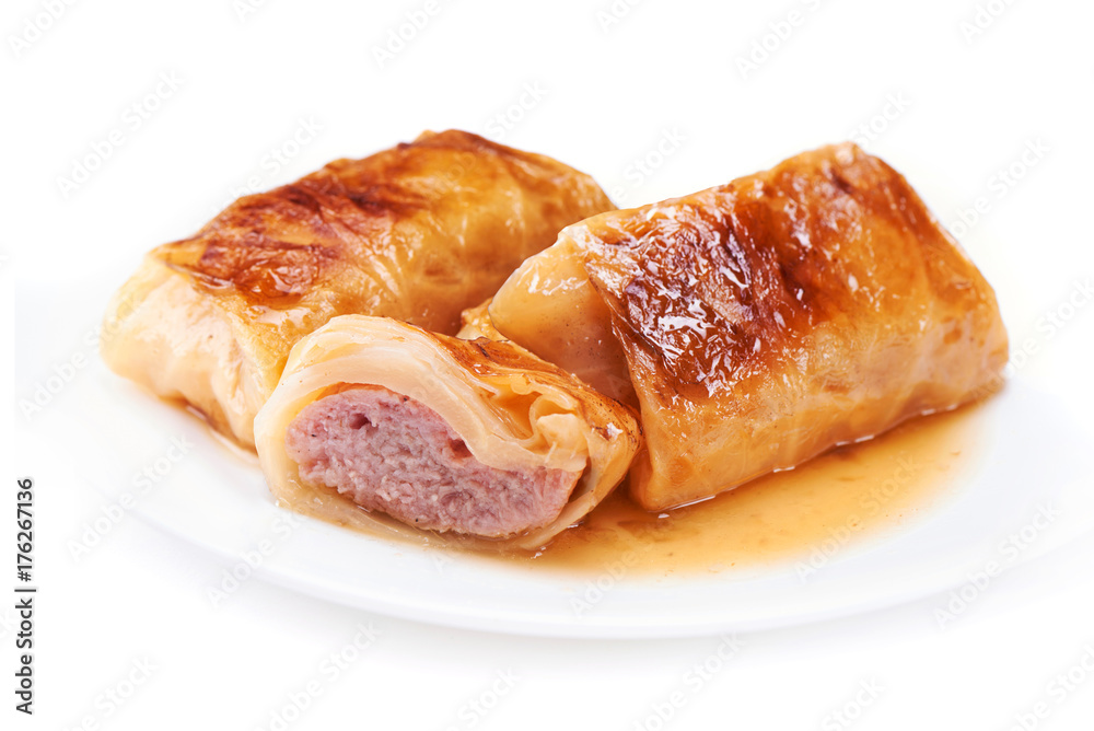 Stuffed cabbage rolls with pork meat isolated on white plate isolated on white background Stuffed cabbage rolls with pork meat isolated on white plate isolated on white background