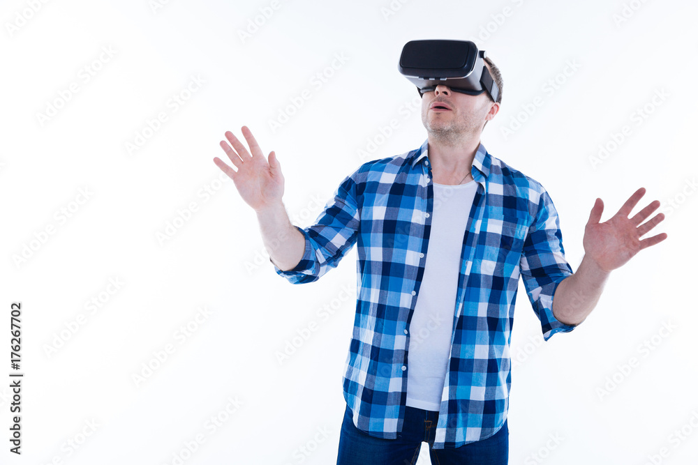 Handsome pleasant man being excited about new technology Handsome pleasant man being excited about new technology