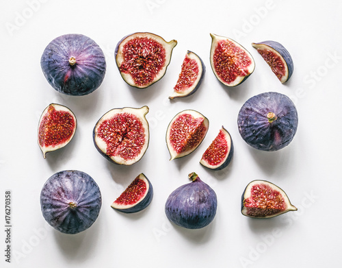 Fresh figs. Food Photo. Creative scheme of the whole and sliced figs on a white background, inscribed in a rectangle. View from above. Copy space photo