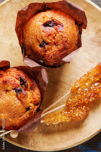 Blueberry muffins and fresh berries. Tasty dessert. Light breakfast. St. Valentine's Day. Dark background.