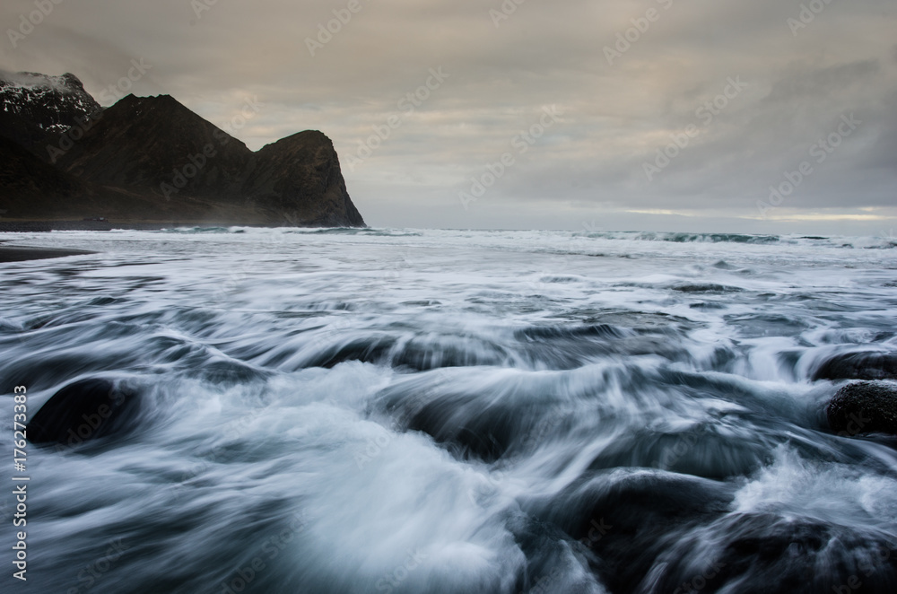 Long exposure of the sea on the coast of the Lofoten Islands with round rocks in the foreground 3 Long exposure of the sea on the coast of the Lofoten Islands with round rocks in the foreground 3