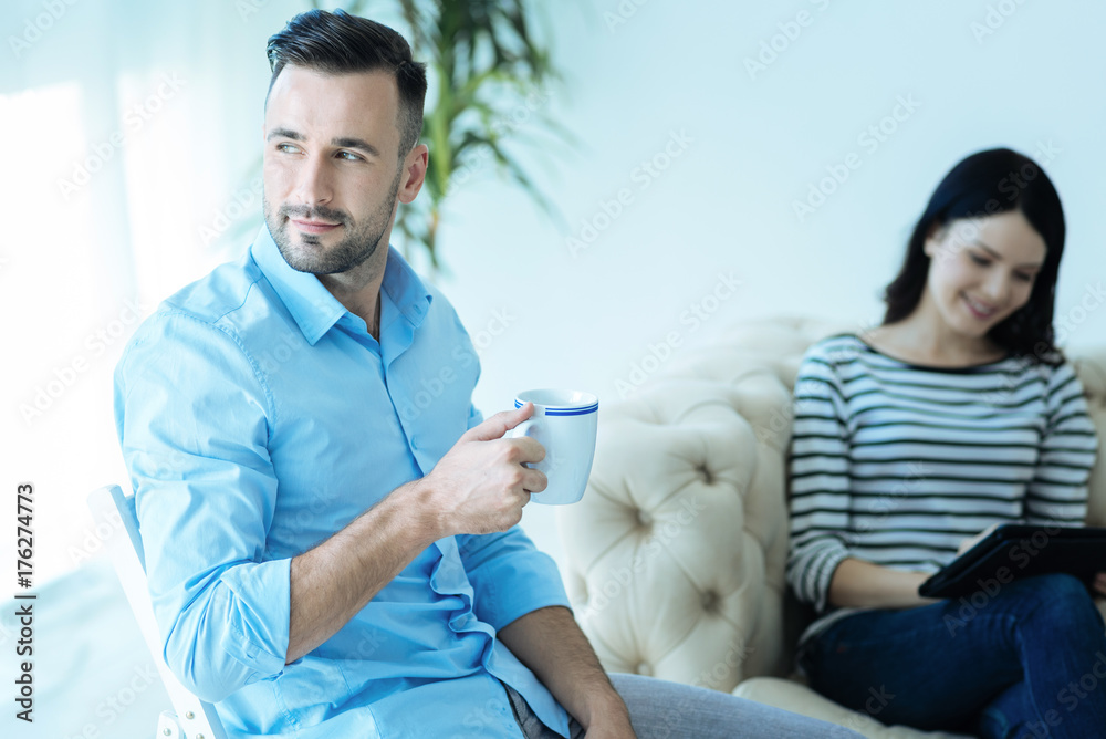 Millennial entrepreneur enjoying his cup of coffee Millennial entrepreneur enjoying his cup of coffee