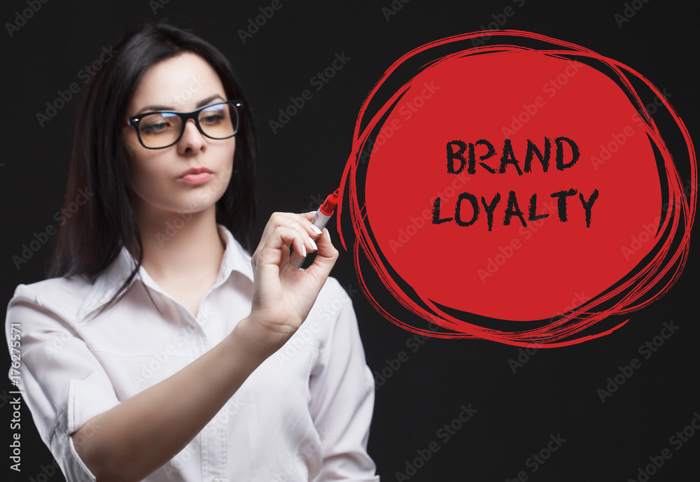 The concept of marketing, technology, the Internet and the network. A young businessman shows what is important for business: Brand loyalty The concept of marketing, technology, the Internet and the network. A young businessman shows what is important for business: Brand loyalty