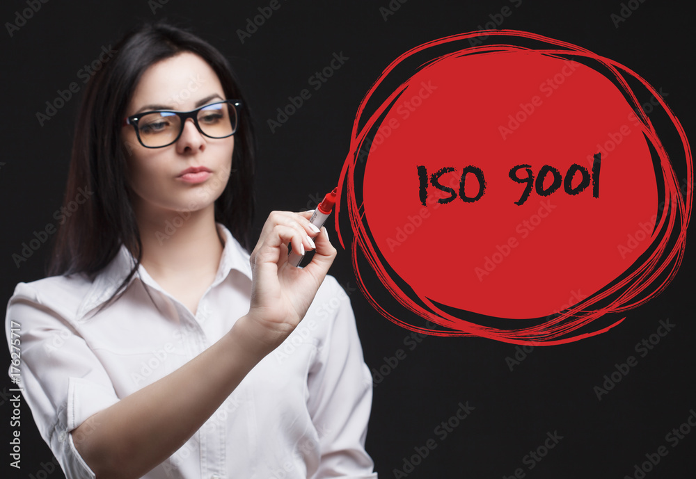 The concept of marketing, technology, the Internet and the network. A young businessman shows what is important for business: ISO 9001 The concept of marketing, technology, the Internet and the network. A young businessman shows what is important for business: ISO 9001
